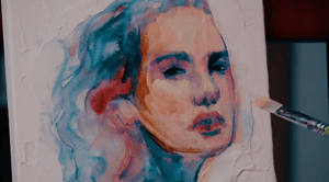 Portrait of blue pink and peach paint colors with paint brush